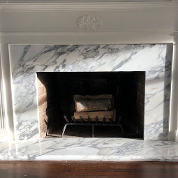Calacatta cervaiole polished marble fireplace